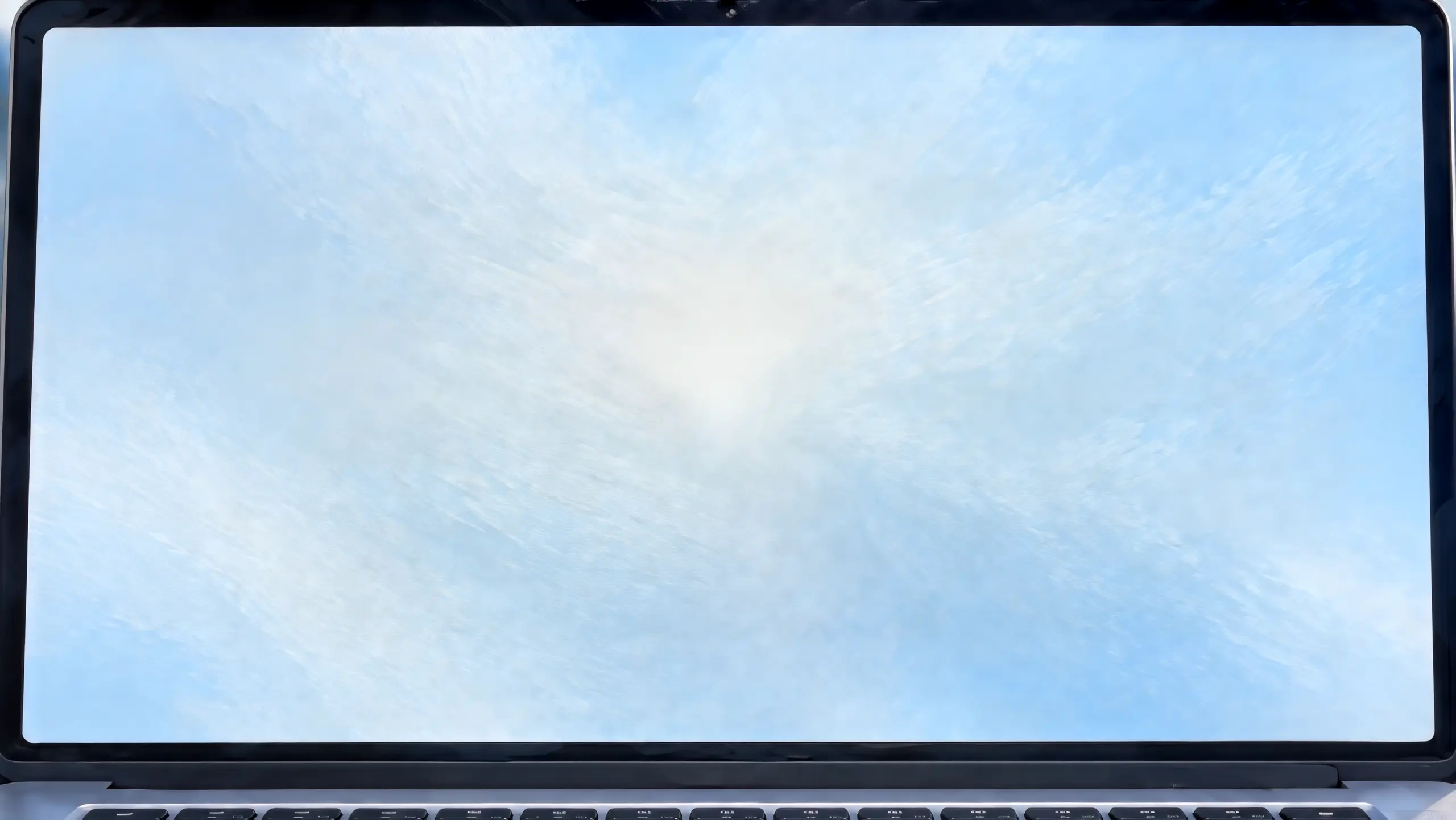 A laptop screen filled with soft blue light